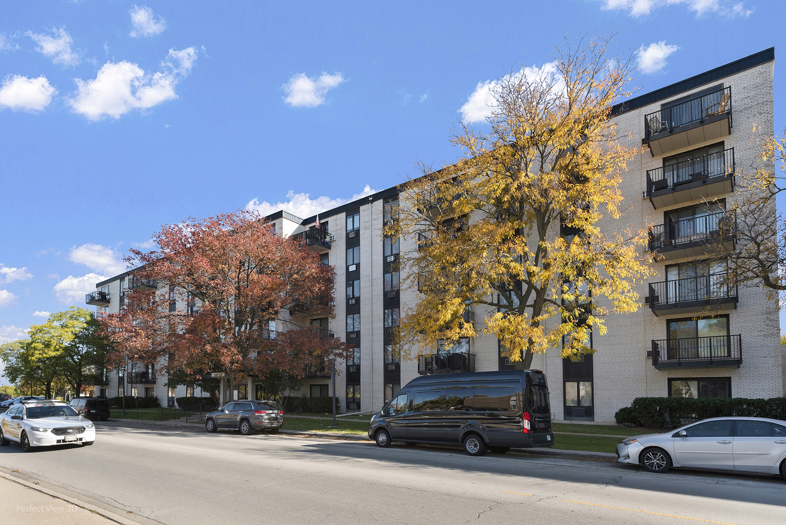 9701 North Dee Road, Unit 5E Niles, IL 60714 - Photo 18 of 18 a view of a cars parked in front of a building