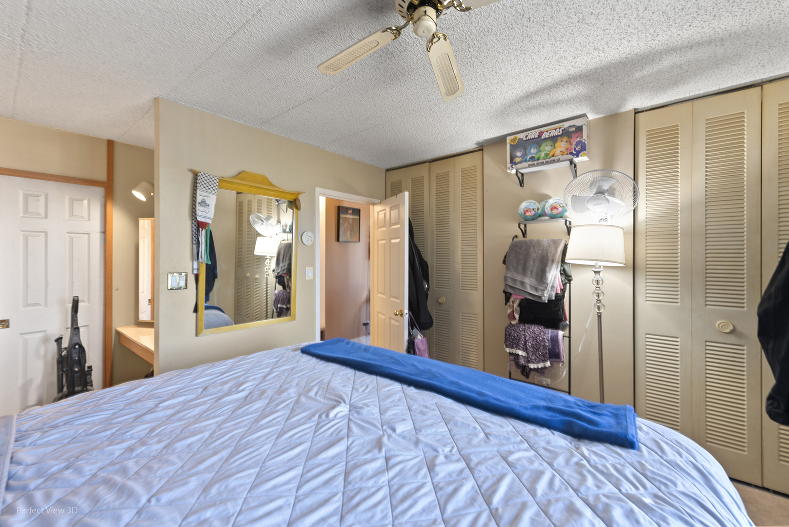 9701 North Dee Road, Unit 5E Niles, IL 60714 - Photo 8 of 18 a bedroom with a bed and a large mirror