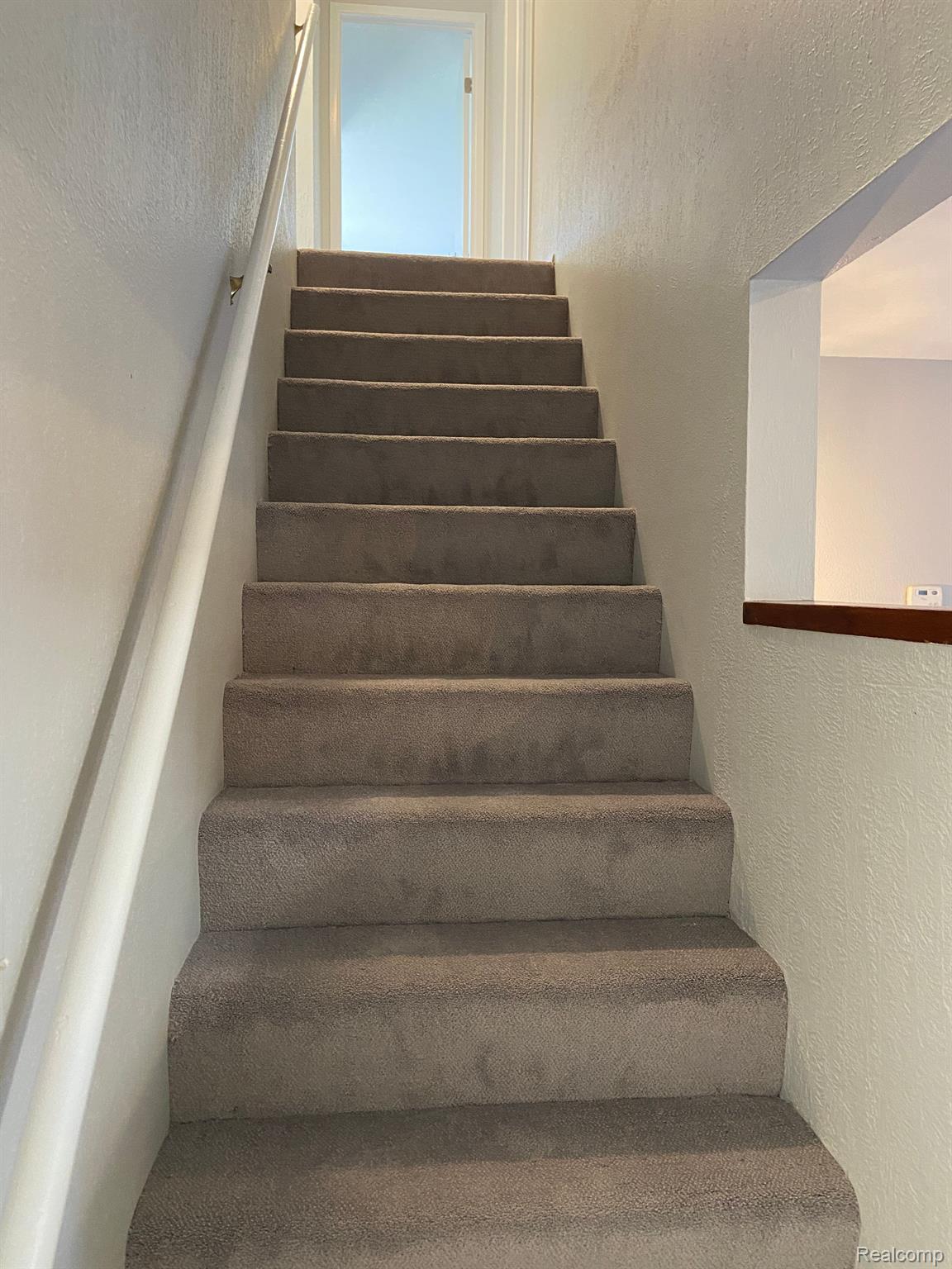 5045 North Crooks Road, Unit 20 Royal Oak, MI 48073 - Photo 37 of 46 Staircase to second floor.