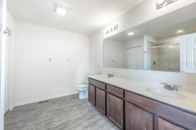 a bathroom with a granite countertop sink mirror and double
