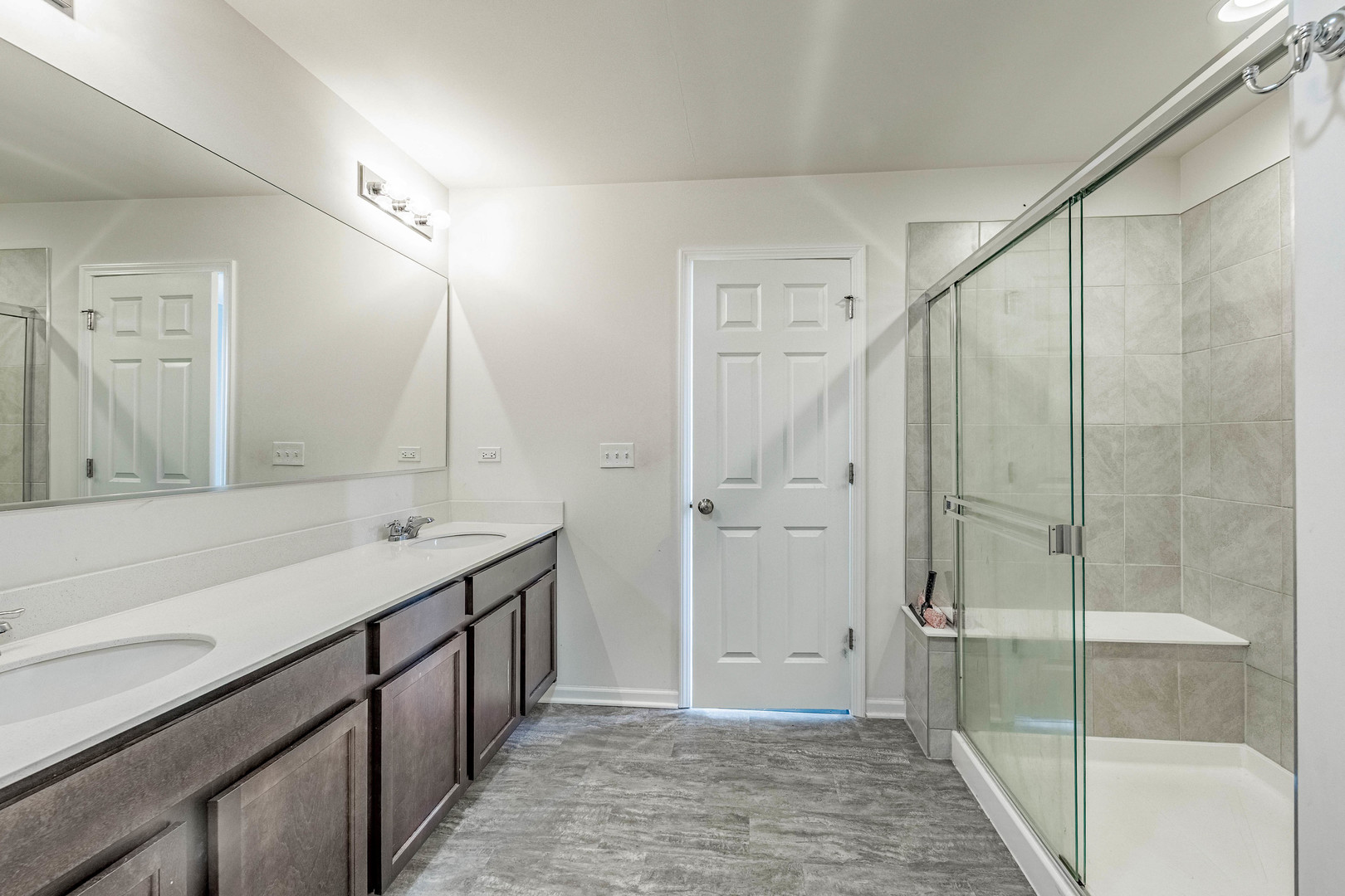 1019 Freeman Street Plano, IL 60545 - Photo 20 of 28 a bathroom with a shower sink and mirror