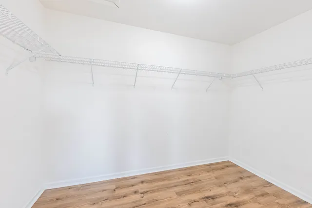 a view of a room with shelf on the wall