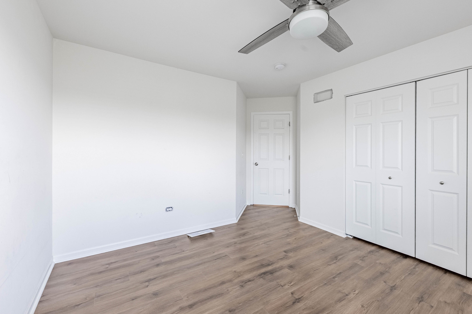 1019 Freeman Street Plano, IL 60545 - Photo 25 of 28 a view of an empty room and wooden floor