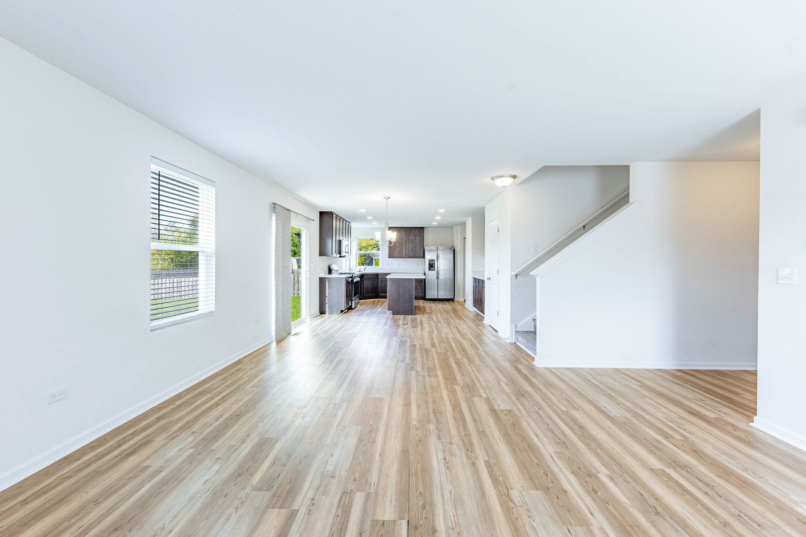 1019 Freeman Street Plano, IL 60545 - Photo 7 of 28 a view of empty room with wooden floor