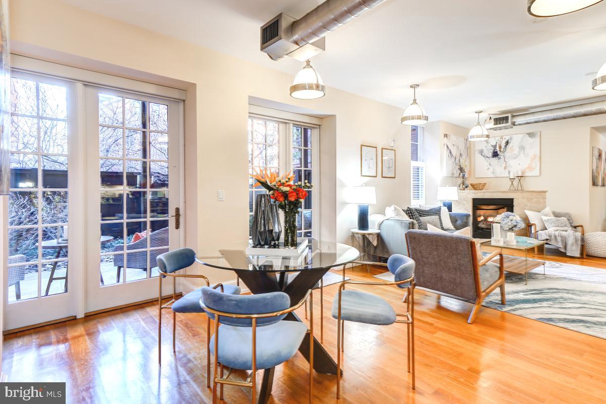 215 I Street Northeast, Unit 111 Washington, DC 20002 - Photo 1 of 34 a living room with furniture and a large window