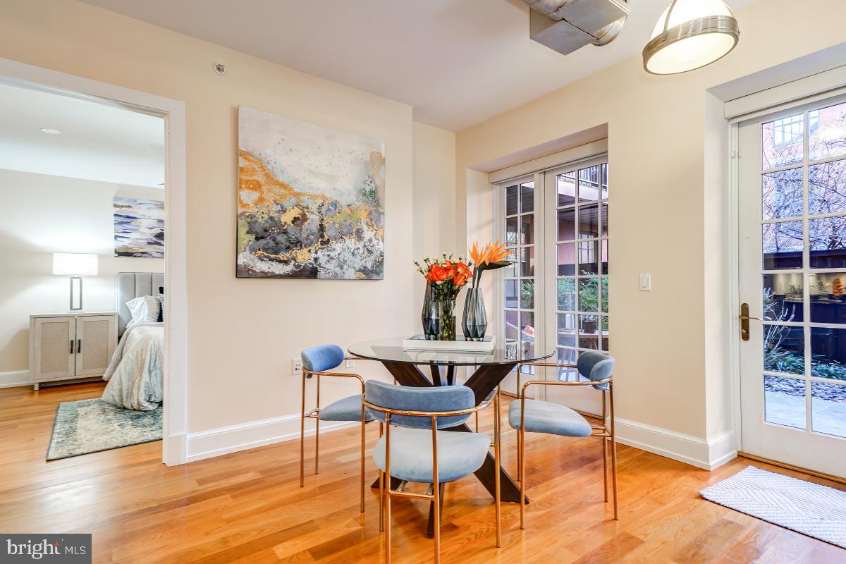 215 I Street Northeast, Unit 111 Washington, DC 20002 - Photo 10 of 34 a dining room with furniture and window