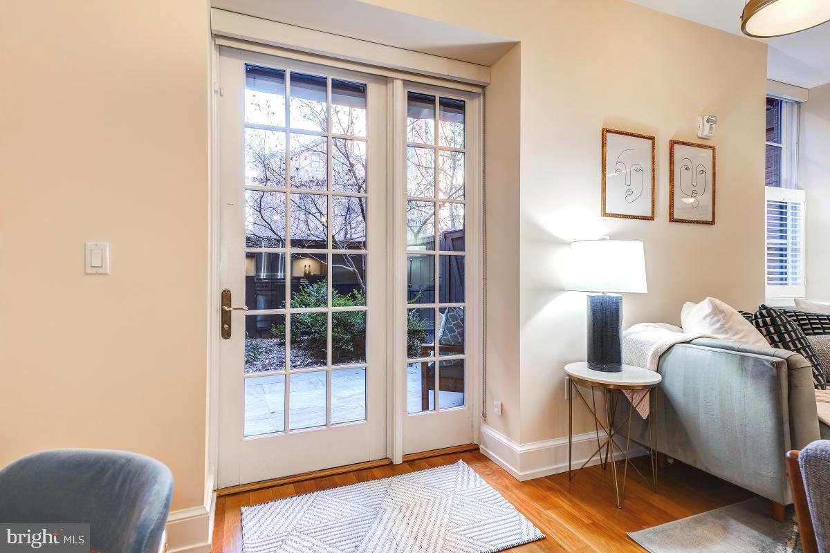 215 I Street Northeast, Unit 111 Washington, DC 20002 - Photo 12 of 34 a living room with furniture and a window