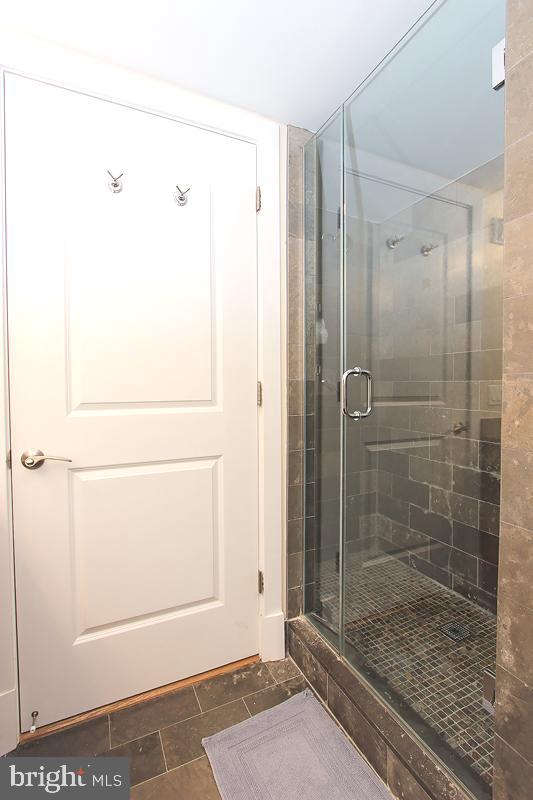 215 I Street Northeast, Unit 111 Washington, DC 20002 - Photo 22 of 34 a bathroom with a shower