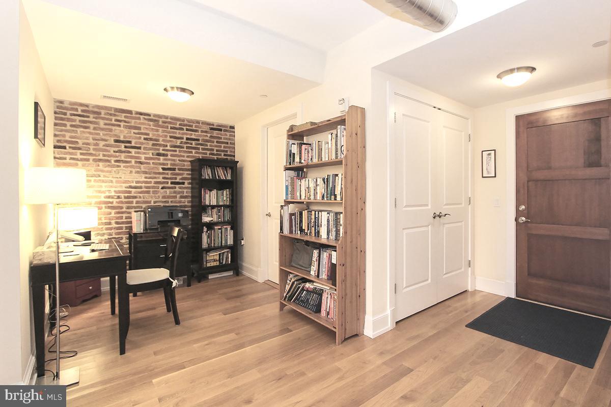 215 I Street Northeast, Unit 111 Washington, DC 20002 - Photo 7 of 34 a view of a livingroom with furniture and front door
