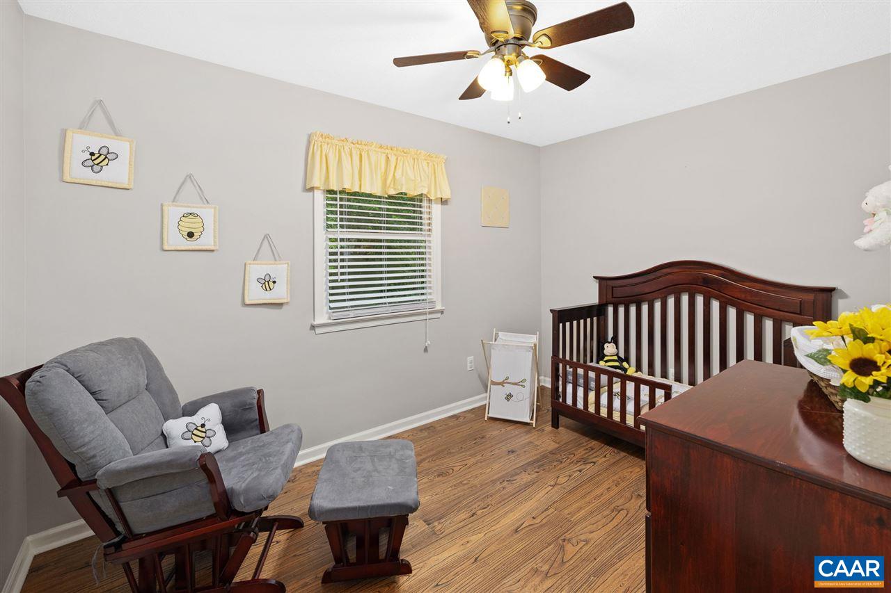 949 Chapman Road Stanardsville, VA 22973 - Photo 11 of 41 a bedroom with furniture and a window