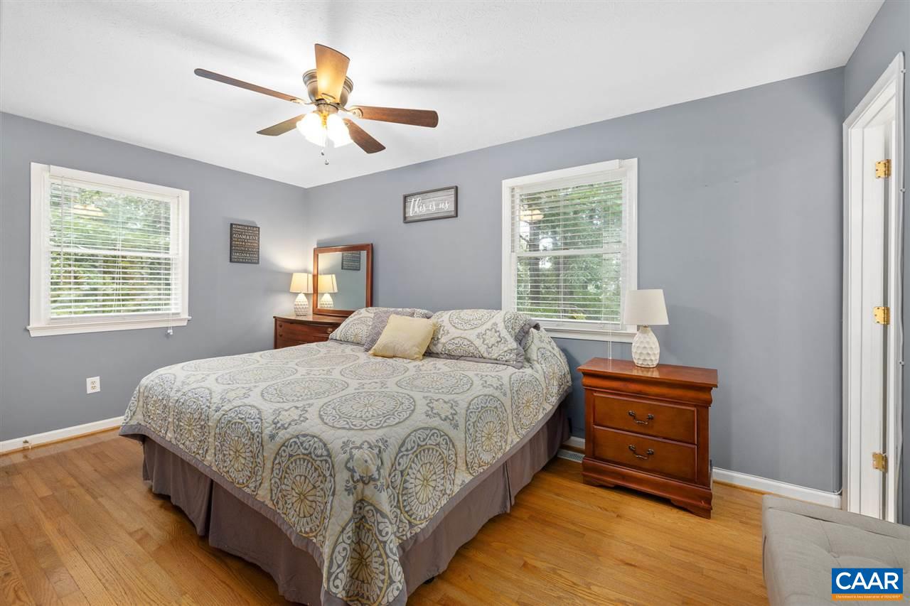 949 Chapman Road Stanardsville, VA 22973 - Photo 14 of 41 a bedroom with bed and window