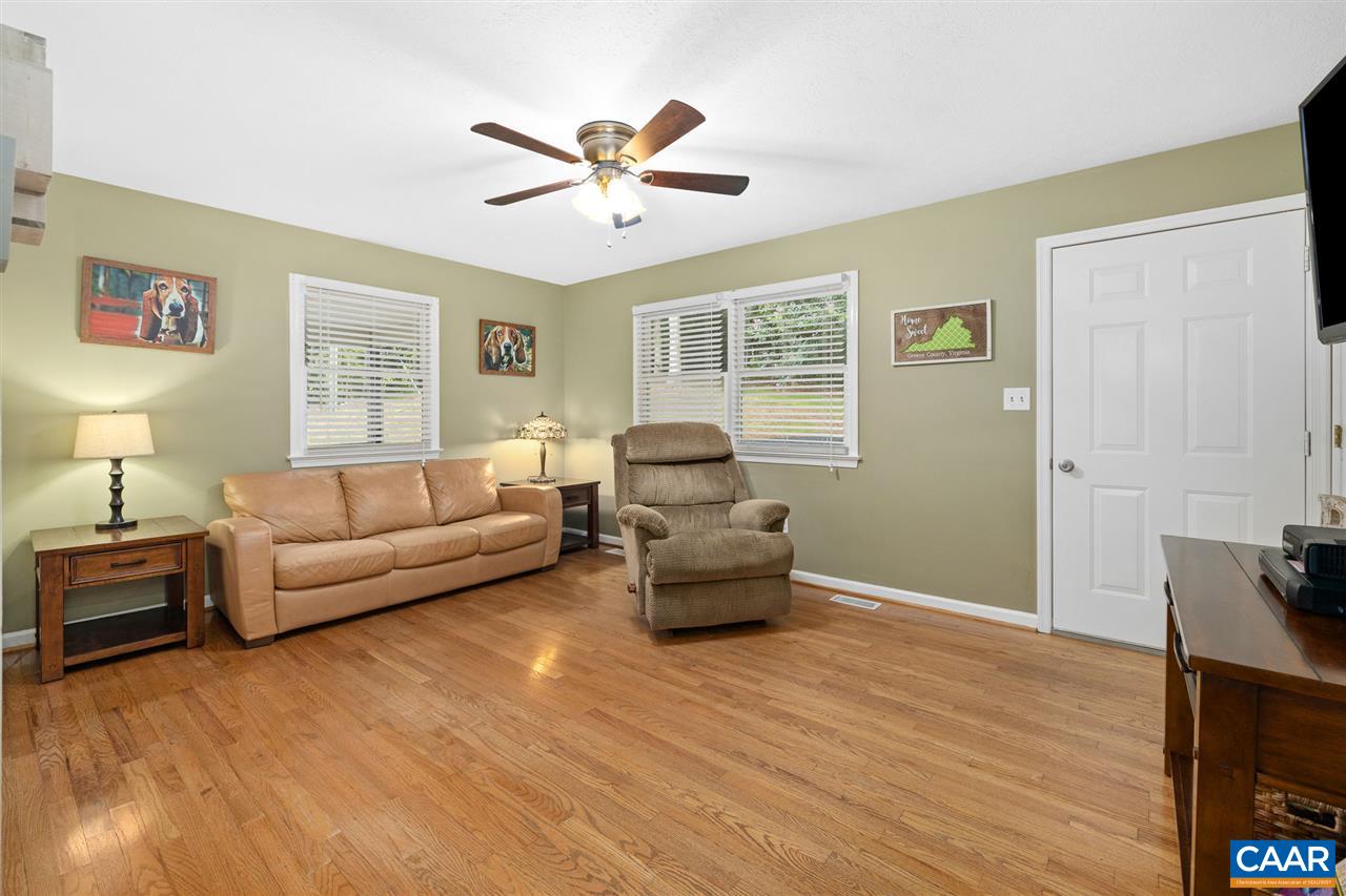 949 Chapman Road Stanardsville, VA 22973 - Photo 3 of 41 a living room with furniture and a flat screen tv