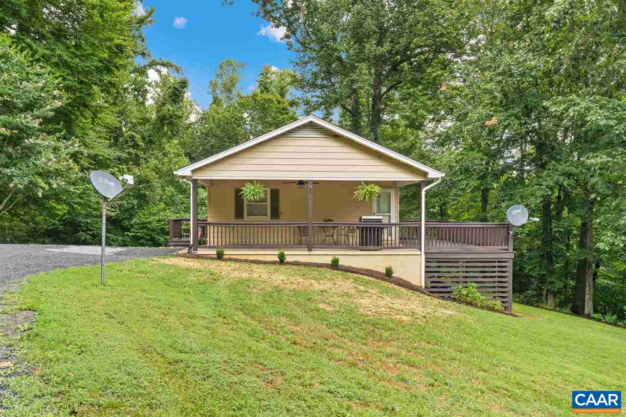 949 Chapman Road Stanardsville, VA 22973 - Photo 31 of 41 a view of a house with a yard and sitting area