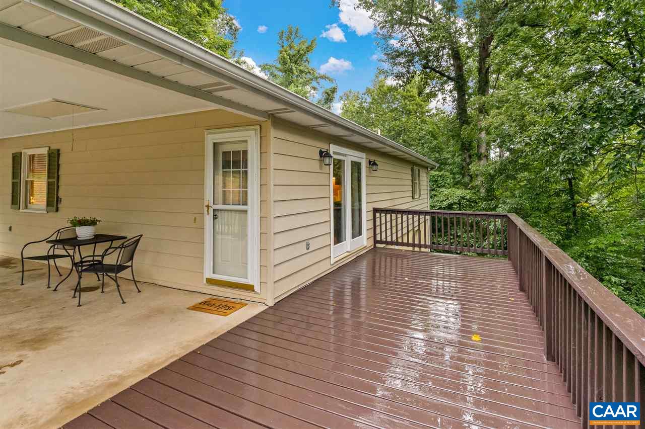 949 Chapman Road Stanardsville, VA 22973 - Photo 36 of 41 a balcony with wooden floor and furniture