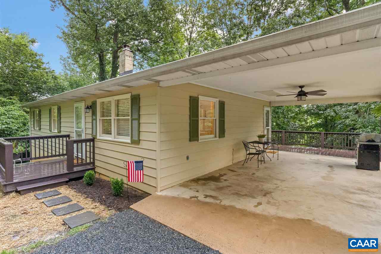 949 Chapman Road Stanardsville, VA 22973 - Photo 38 of 41 a backyard with a table and chairs and potted plants