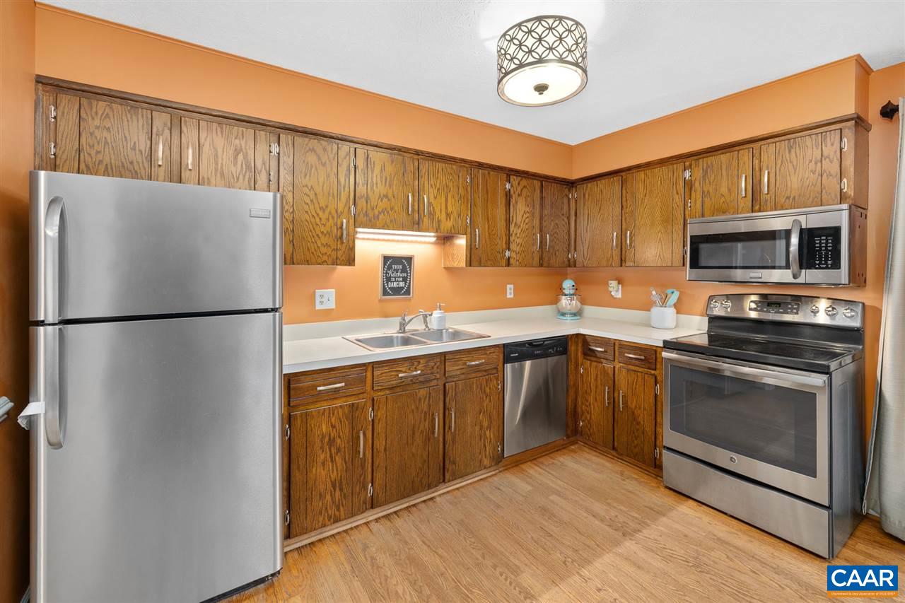 949 Chapman Road Stanardsville, VA 22973 - Photo 7 of 41 a kitchen with stainless steel appliances granite countertop a refrigerator a stove top oven a sink and dishwasher