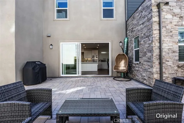 a balcony with furniture and a rug