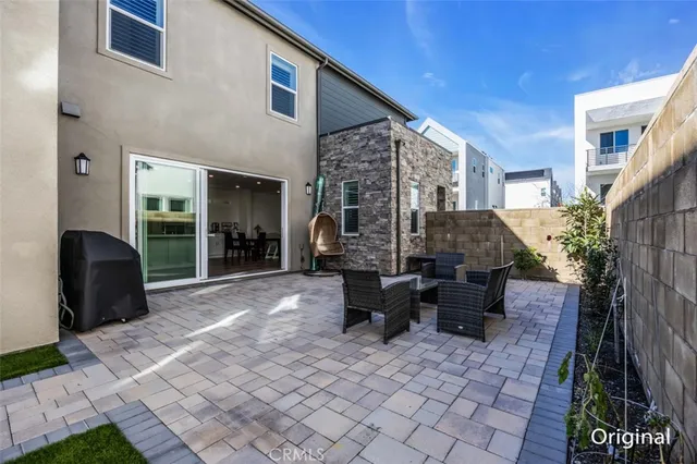 a view of a patio with a table and chairs