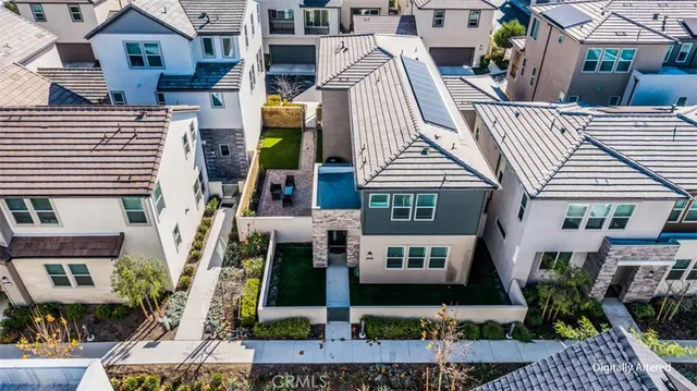 a front view of residential houses with pathway