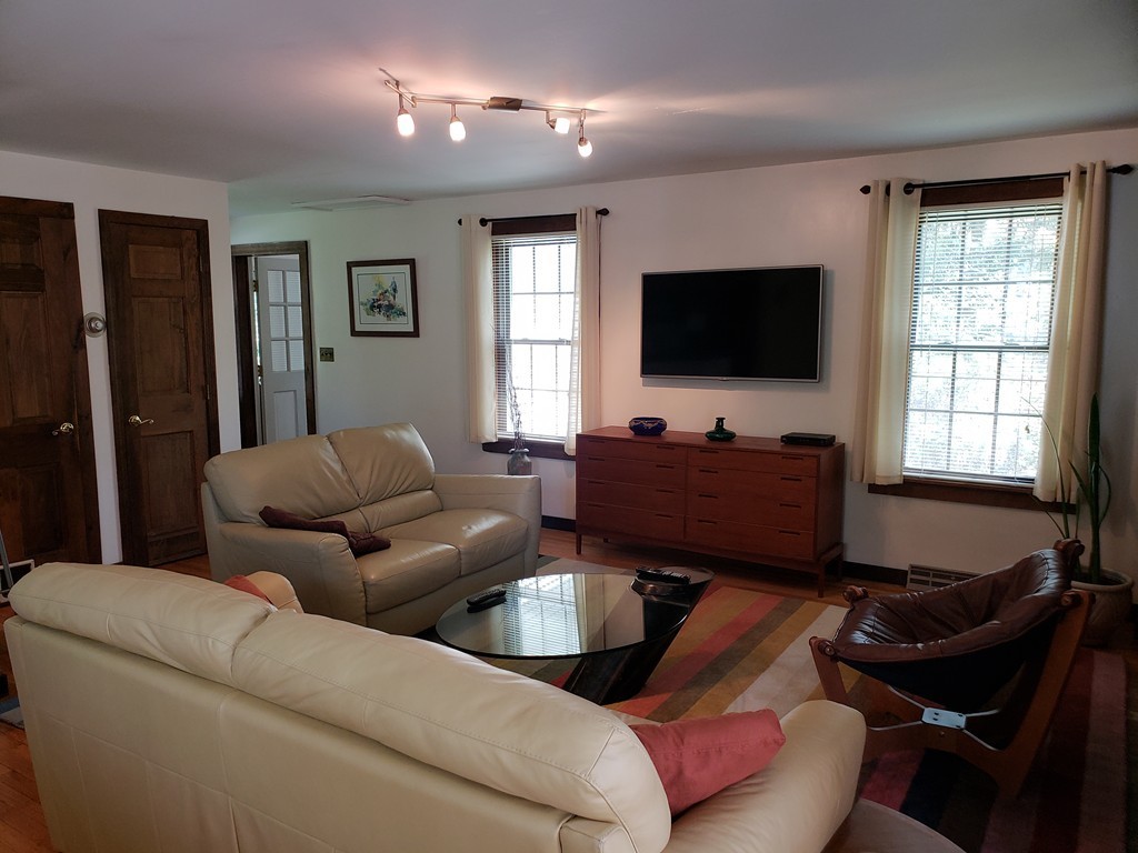 67 Keyes Road Holyoke, MA 01040 - Photo 11 of 28 a living room with furniture and a flat screen tv