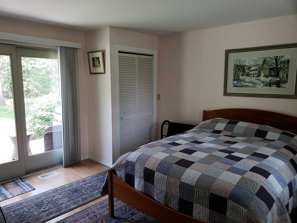 67 Keyes Road Holyoke, MA 01040 - Photo 17 of 28 a bedroom with a bed and wooden floor