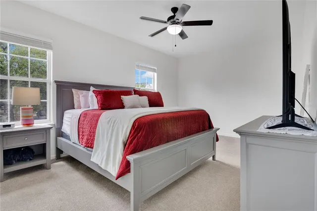 a bedroom with bed and a window