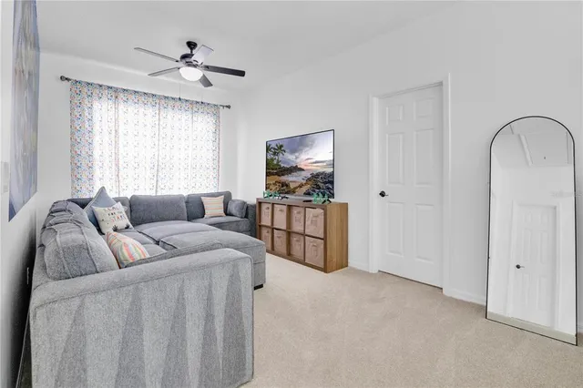 a living room with furniture and windows