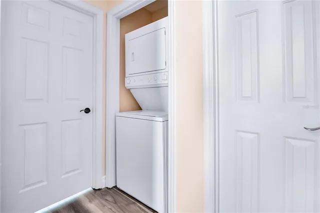 a view of front door with wooden floor