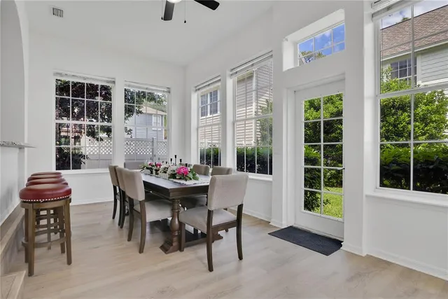 a view of a dining room with furniture window and outside view
