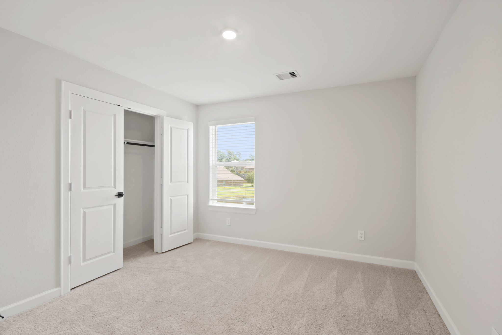 708 Fallen Hemlock Court Conroe, TX 77304 - Photo 11 of 15 an empty room with windows