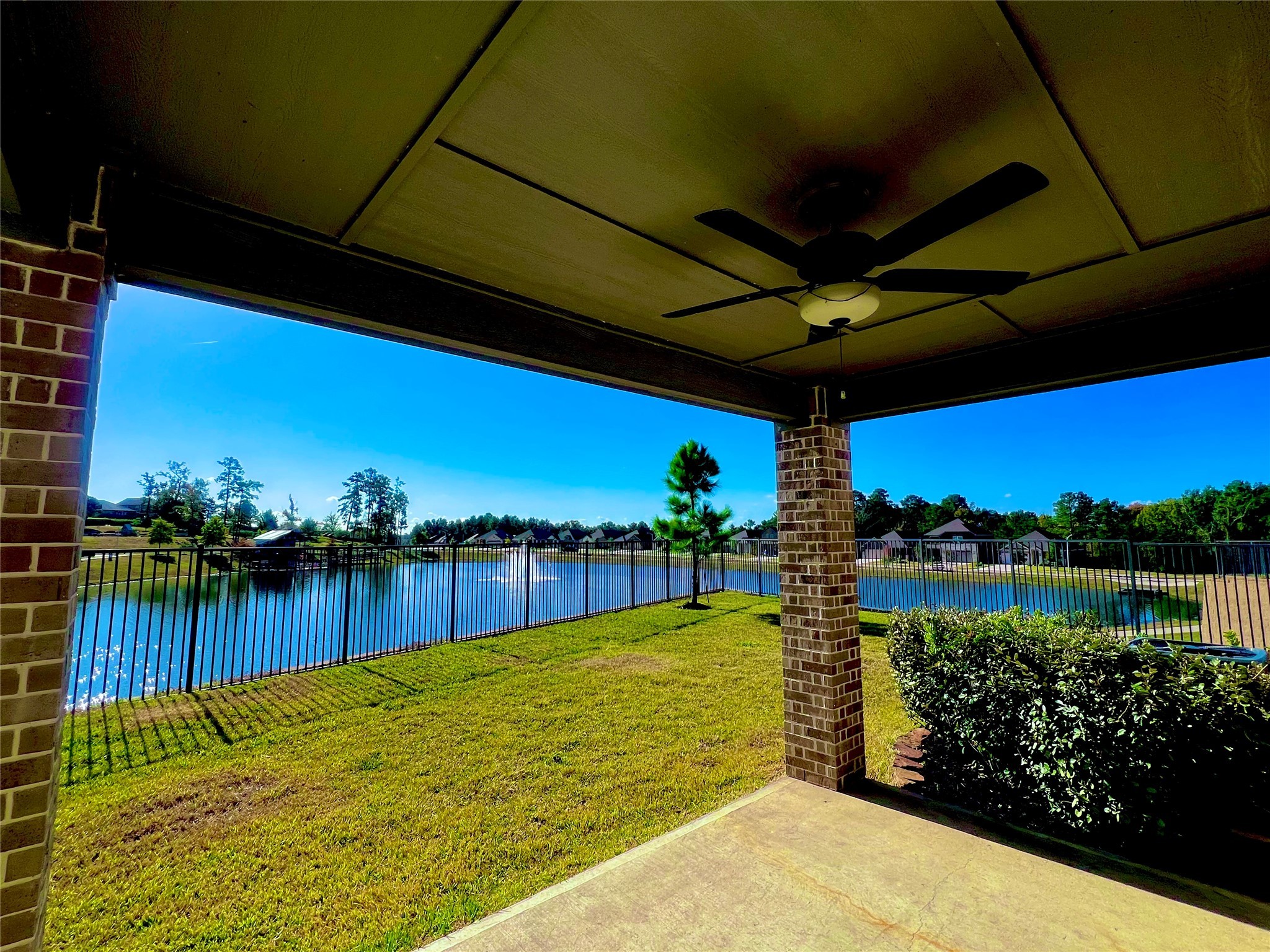 708 Fallen Hemlock Court Conroe, TX 77304 - Photo 14 of 15 a view of a swimming pool with a patio