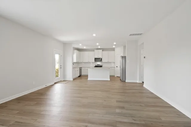 a view of kitchen with wooden floor