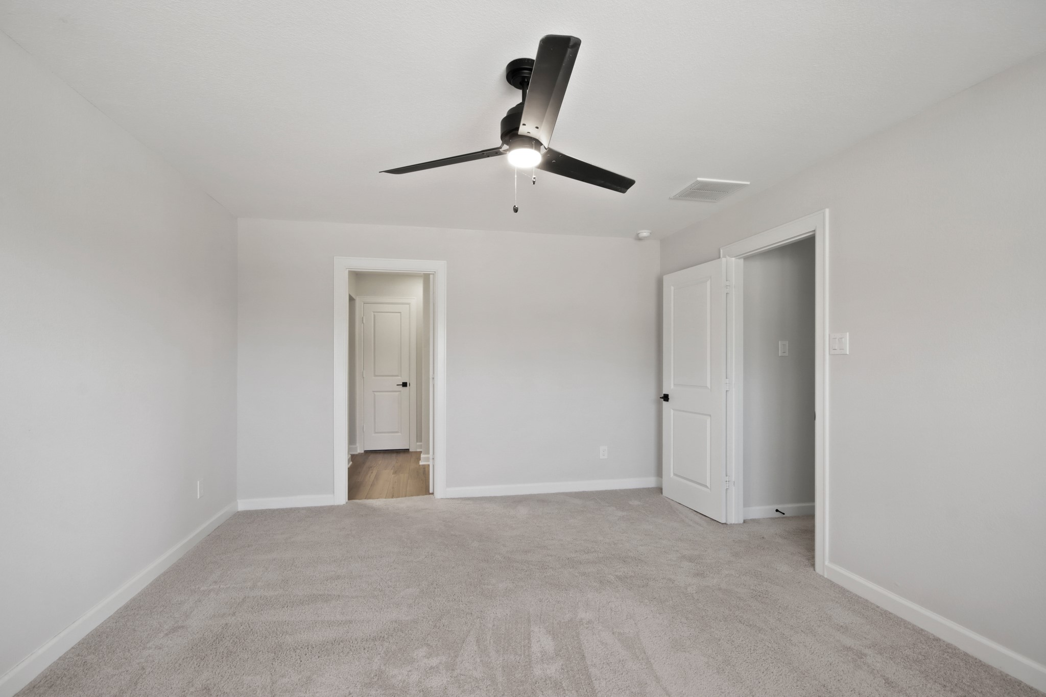 708 Fallen Hemlock Court Conroe, TX 77304 - Photo 8 of 15 a view of an empty room and chandelier fan