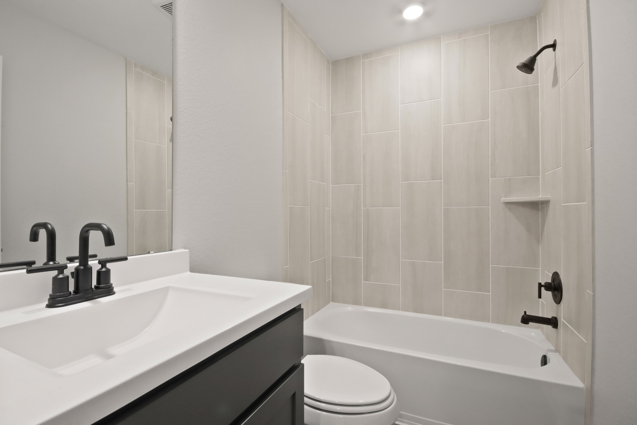 708 Fallen Hemlock Court Conroe, TX 77304 - Photo 10 of 15 a bathroom with a sink a toilet and shower