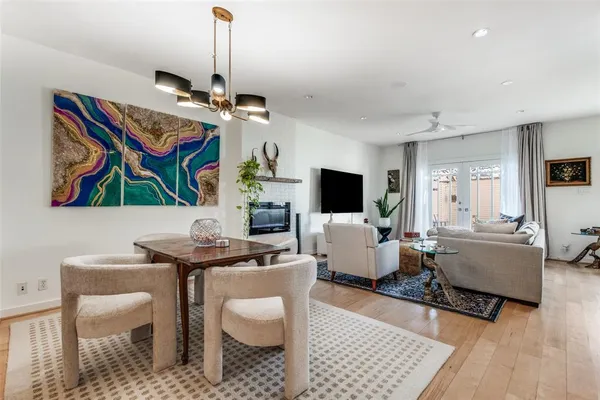 a living room with furniture a rug and a flat screen tv