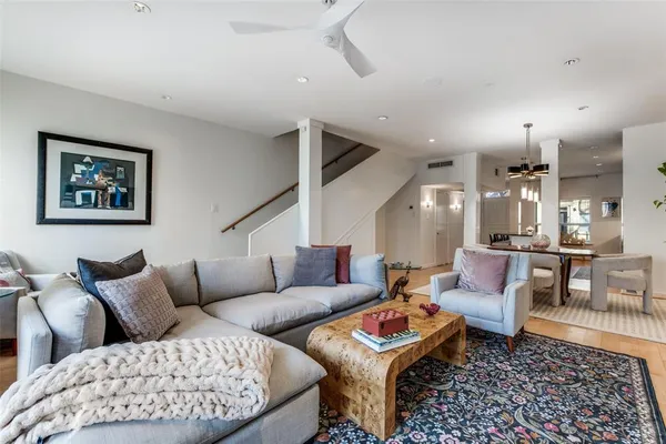 a living room with furniture and a rug