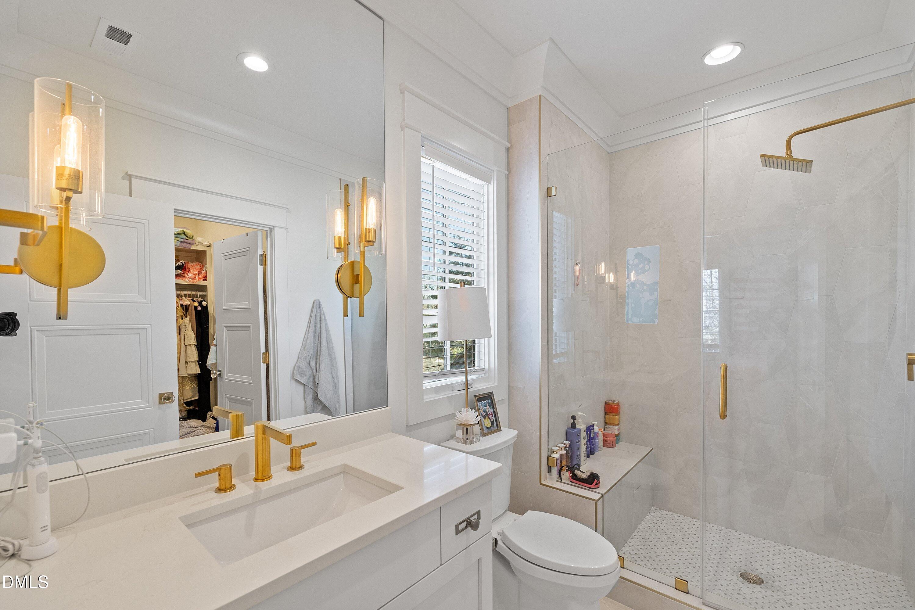 906 Brooks Avenue Raleigh, NC 27607 - Photo 42 of 64 a bathroom with a sink a toilet and shower