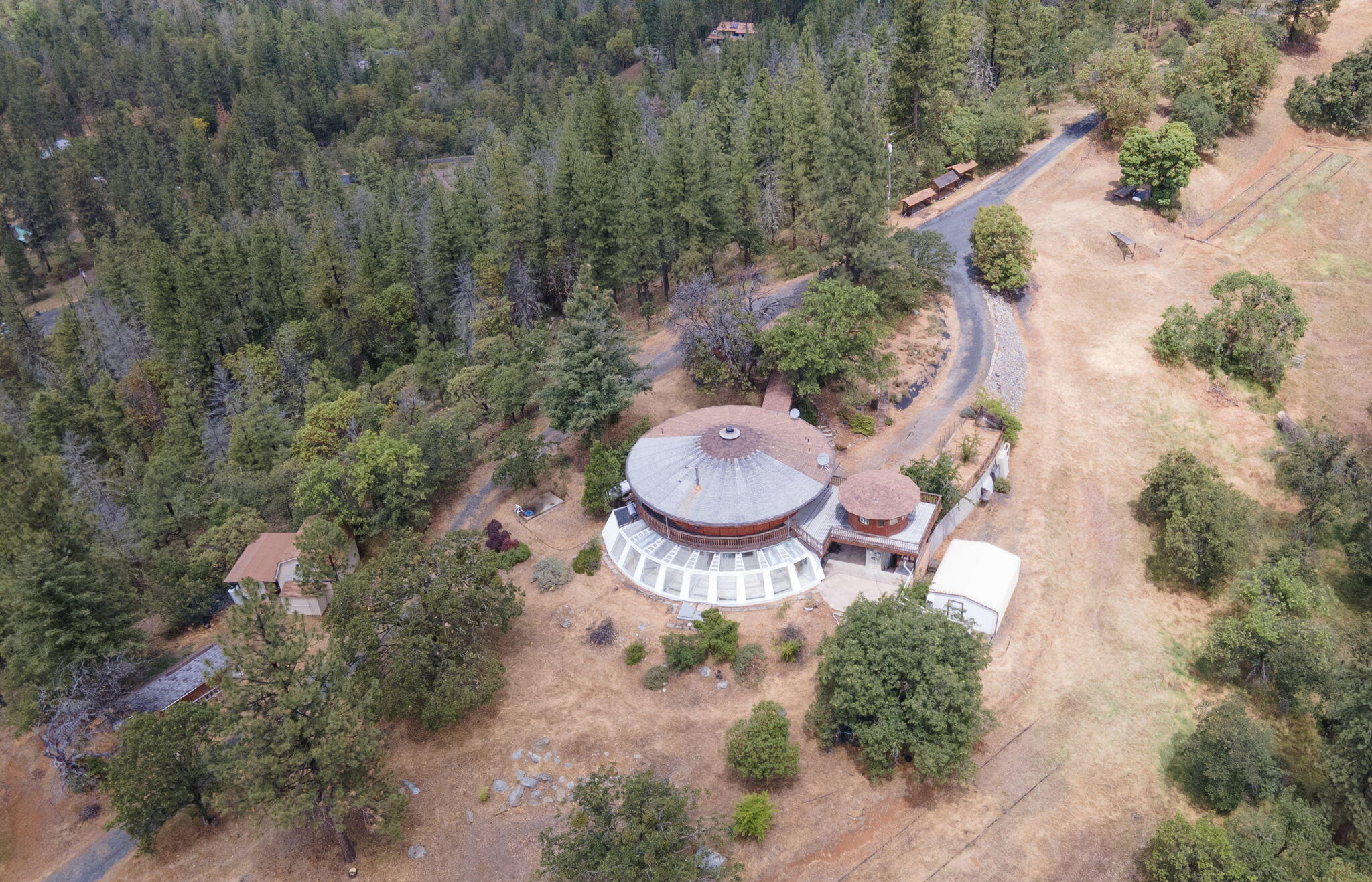 9595 Sterling Creek Road Jacksonville, OR 97530 - Photo 2 of 76 an aerial view of a house with outdoor space