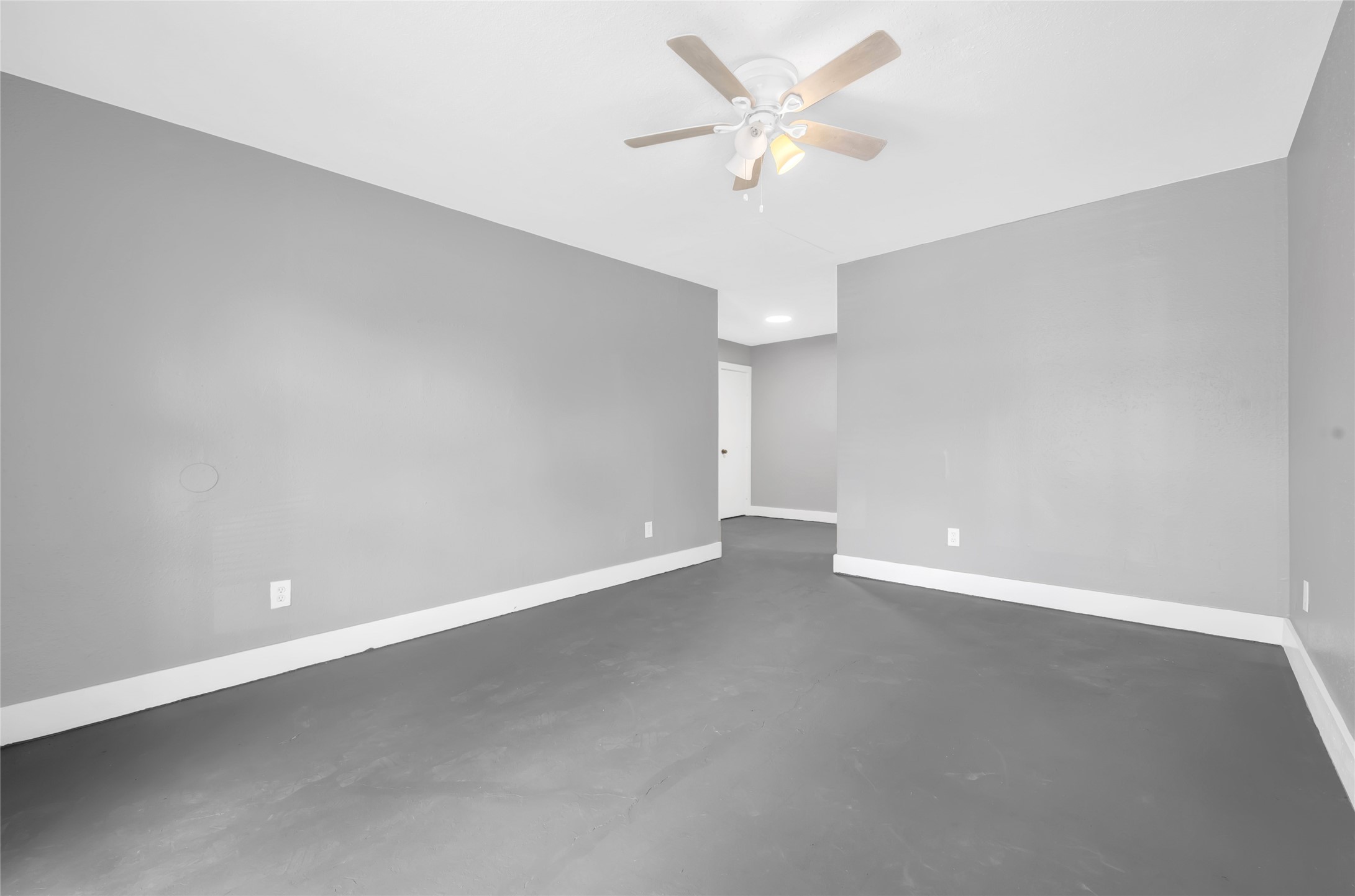 3802 Dabney Street, Unit 20 Houston, TX 77026 - Photo 2 of 13 an empty room with a empty space and a ceiling fan