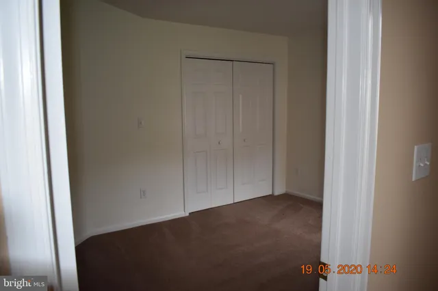 a view of hallway with closet