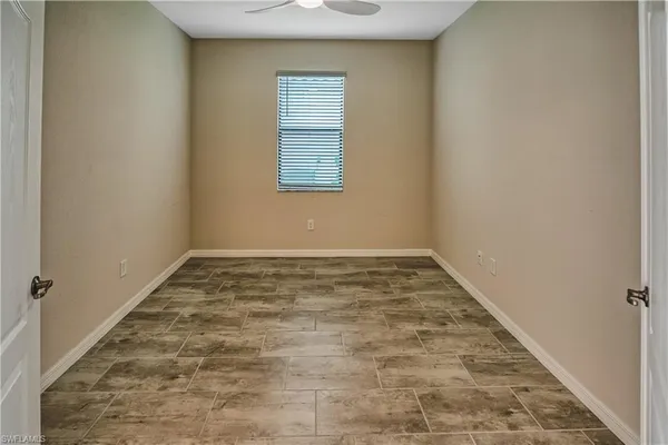 an empty room with a bench