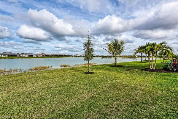a view of a lake with a big yard
