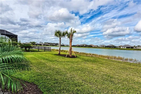 a view of a lake with a big yard