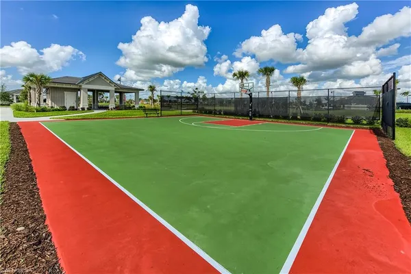 a view of yard with swimming pool and green space