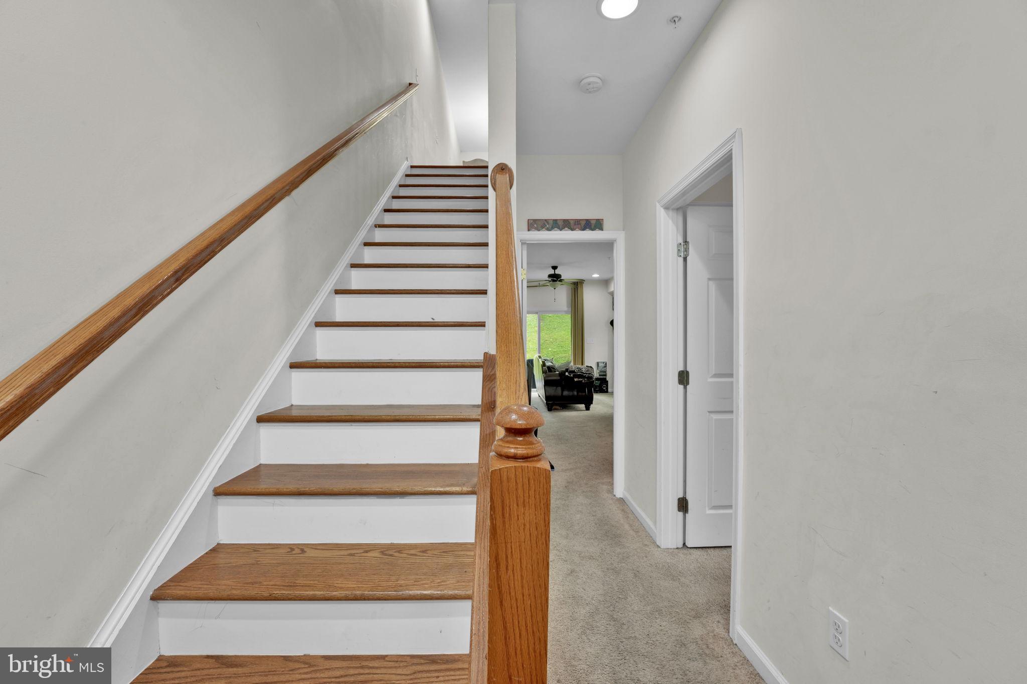 7138 Station House Road Elkridge, MD 21075 - Photo 29 of 42 a view of entryway and hall with wooden floor
