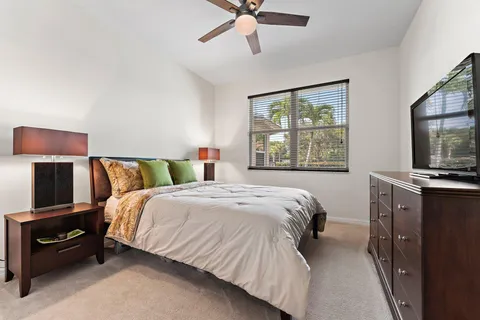 a bedroom with a bed and a tv