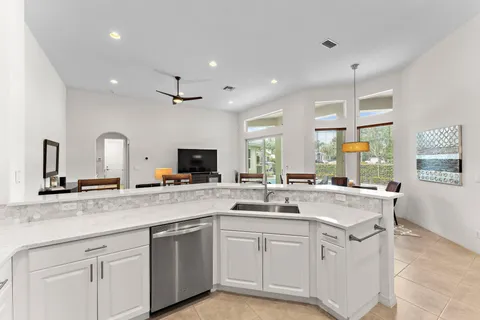 a kitchen with a sink stove and cabinets