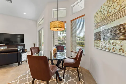 a view of a livingroom with furniture and a flat screen tv