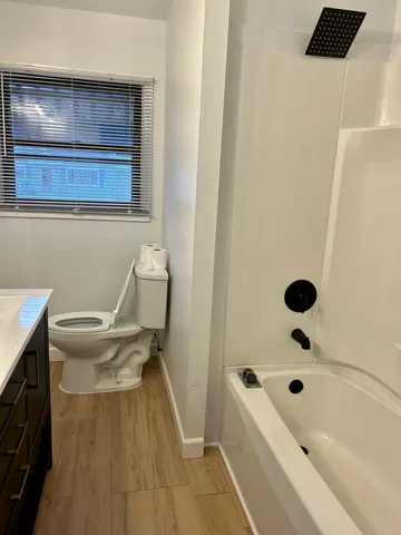 a bathroom with a bathtub and a sink