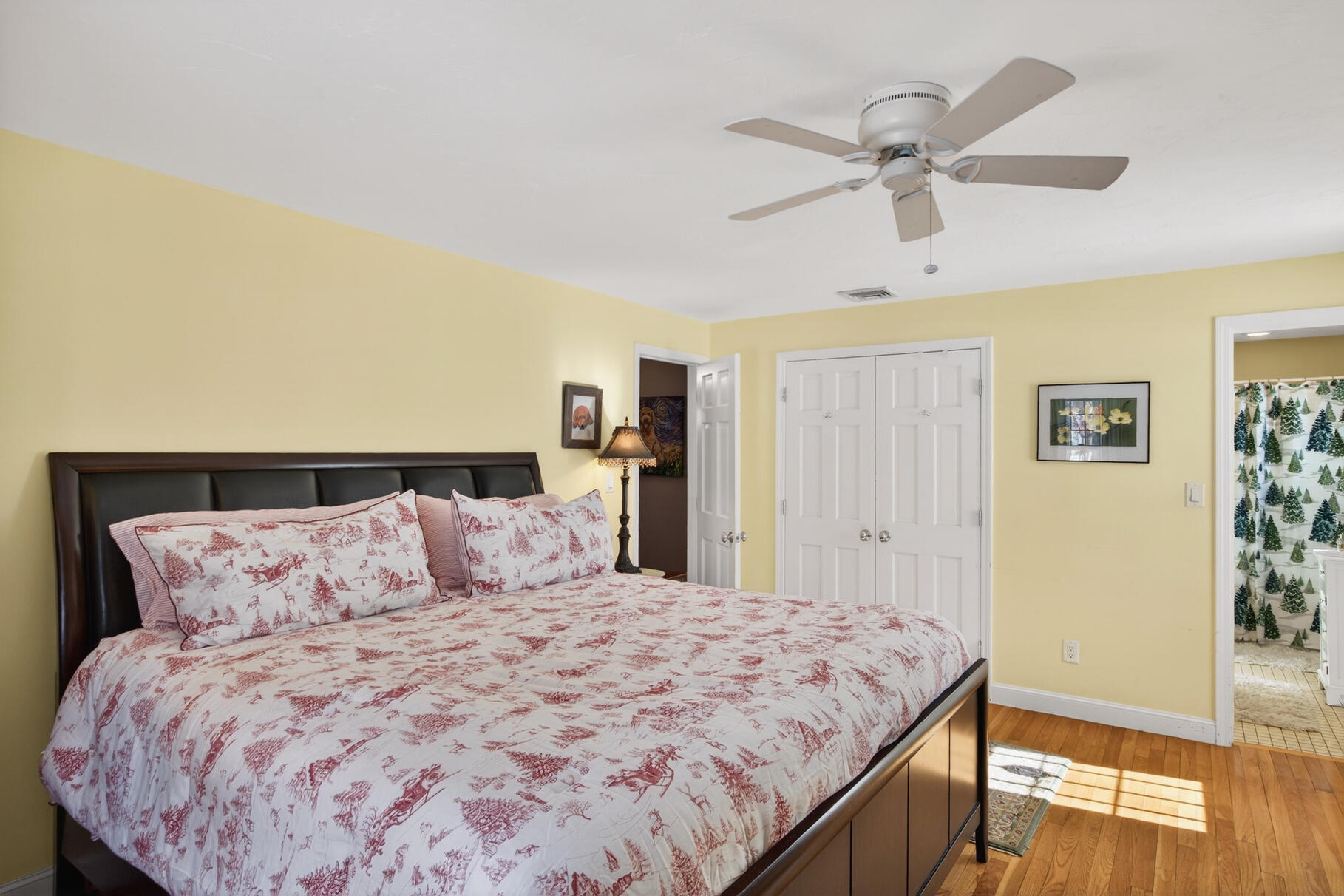48 Holly Ridge Drive Sandwich, MA 02563 - Photo 21 of 48 a bedroom with a large bed and a chandelier